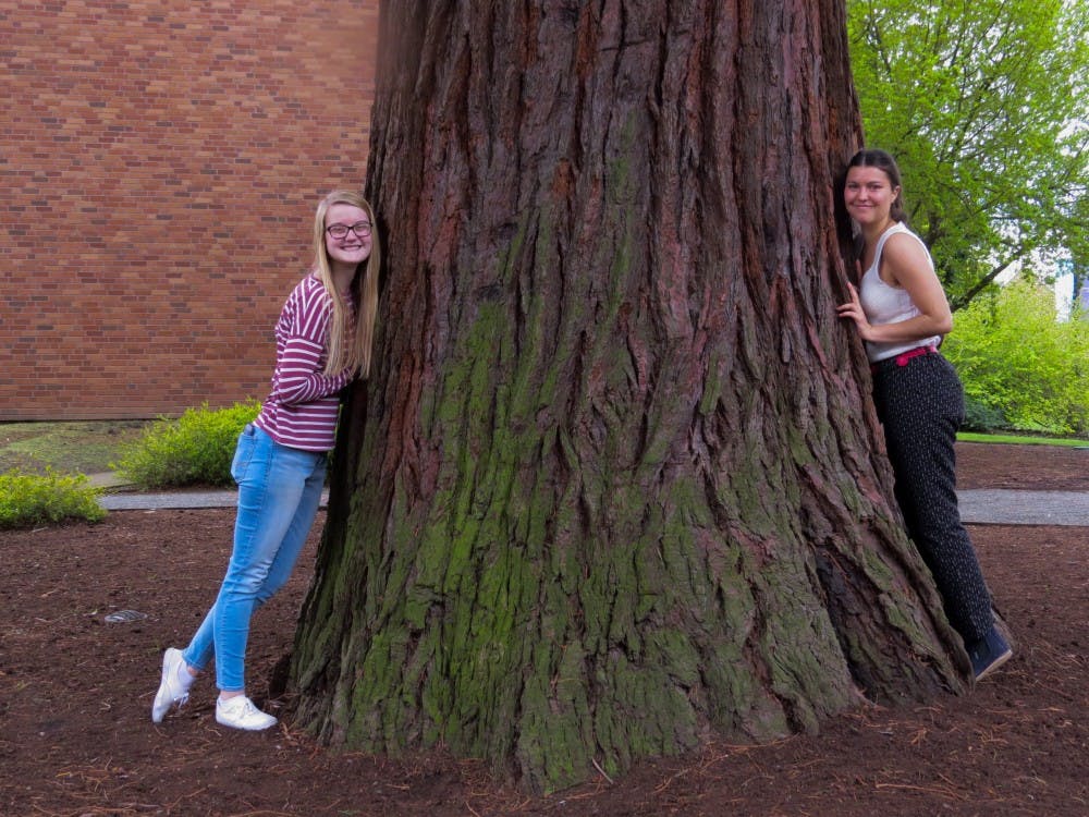 Community Engagement Editor Natalie Nygren poses with College Ecology Club President Ruby Beauchamp.