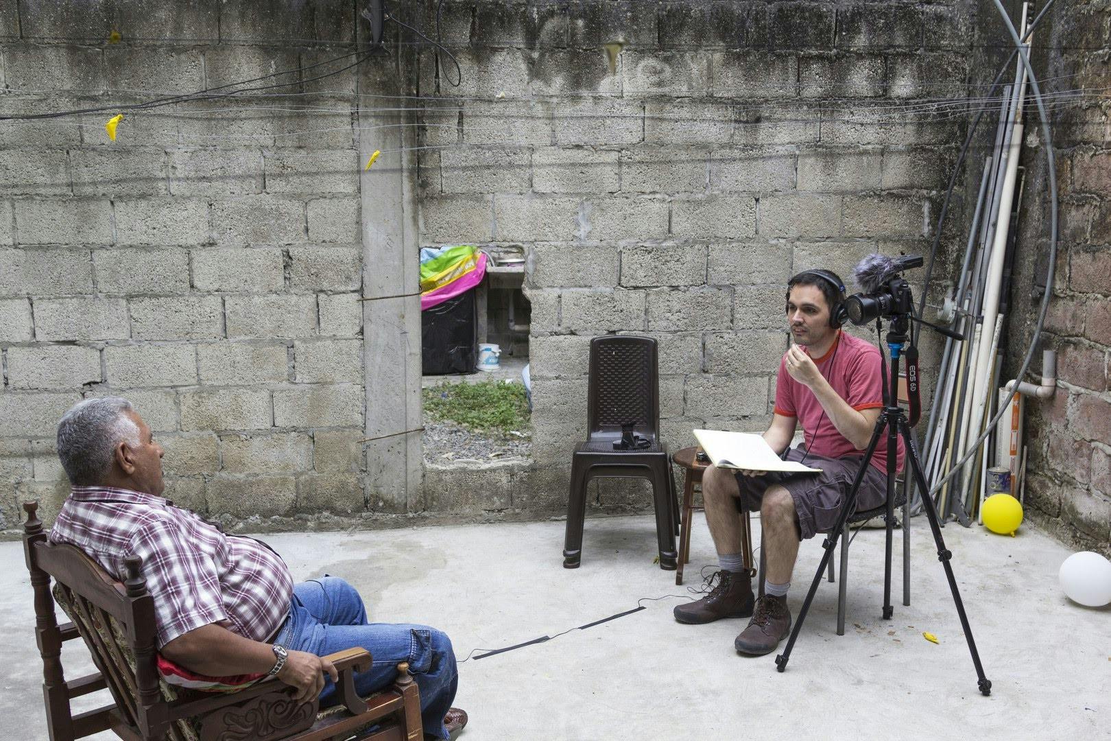 José Velazco conducts an interview for his documentary, "En Vida," in 2016. Image courtesy of José Velazco.