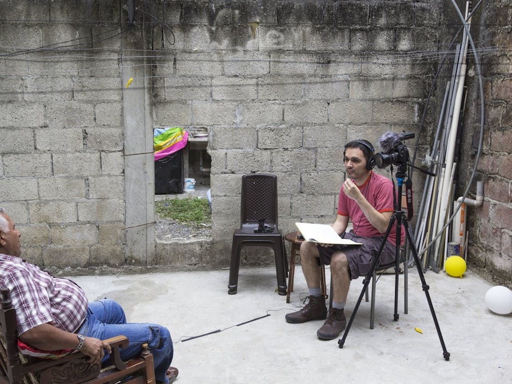 José Velazco conducts an interview for his documentary, &quot;En Vida,&quot; in 2016. Image courtesy of José Velazco.
