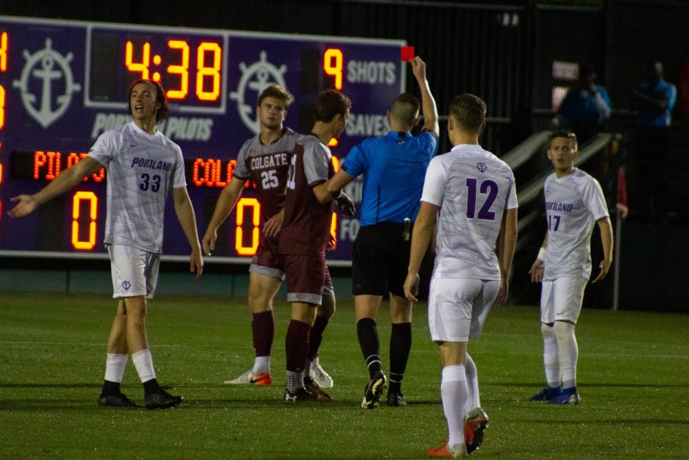 Portland takes a one man advantage after Colgate senior defenseman Christian Clarke receives a red card in the 95th minute.