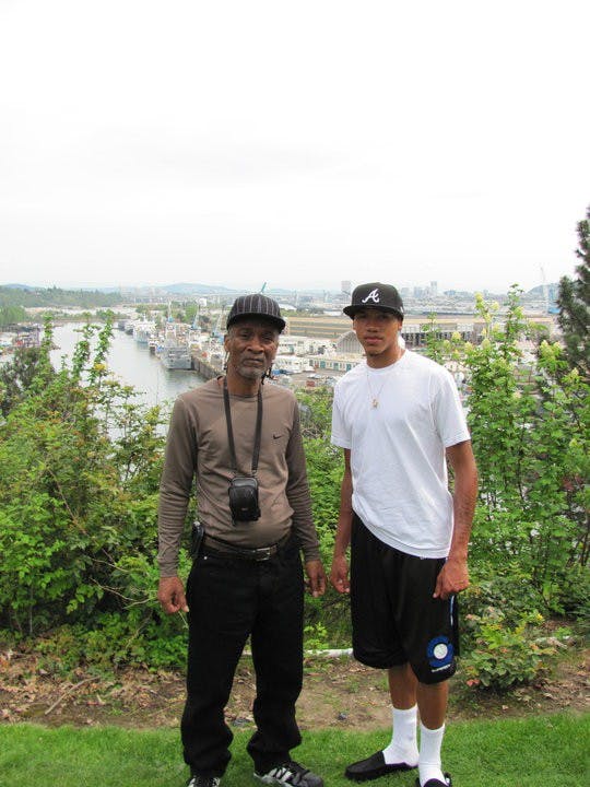  Photo courtesy of Korey Thieleke| Korey Thieleke stands beside grandfather, Johnny Hobson, on a recruiting visit in 2010. Hobson and his wife April took Korey in when he was 4 months old and later adopted him.