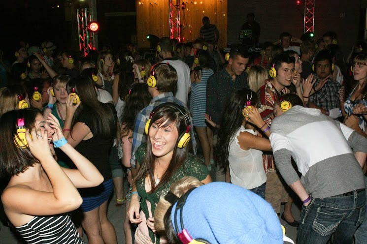  Students dance to the music through their headphones at the fall dance, Nautical Nonsense. It was CPB's first silent disco, which is a dance where the DJ plays the music straight through to listeners' wireless headphones.Photo by Becca Tabor