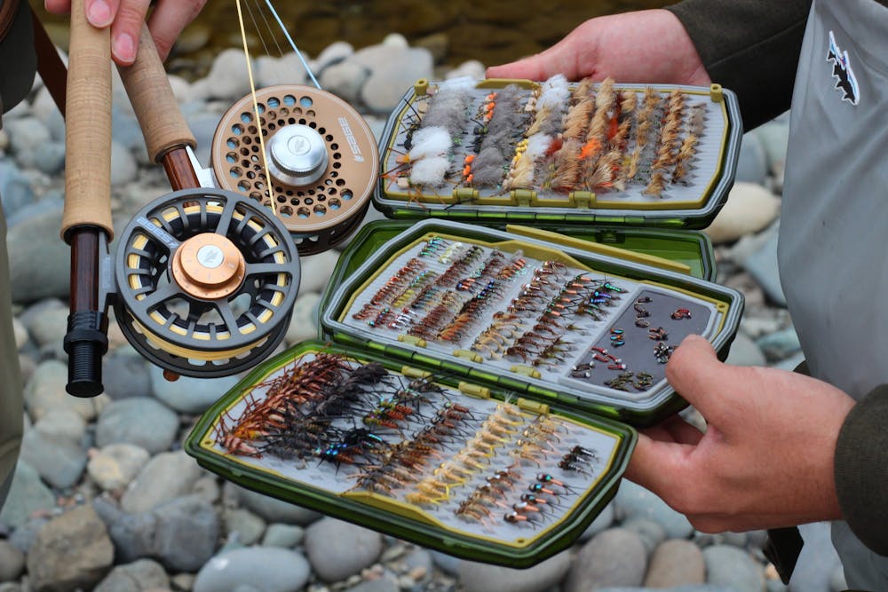 The Jones twins show off their reels and some of the flies they have tied.Photo courtesy of the Jones twins