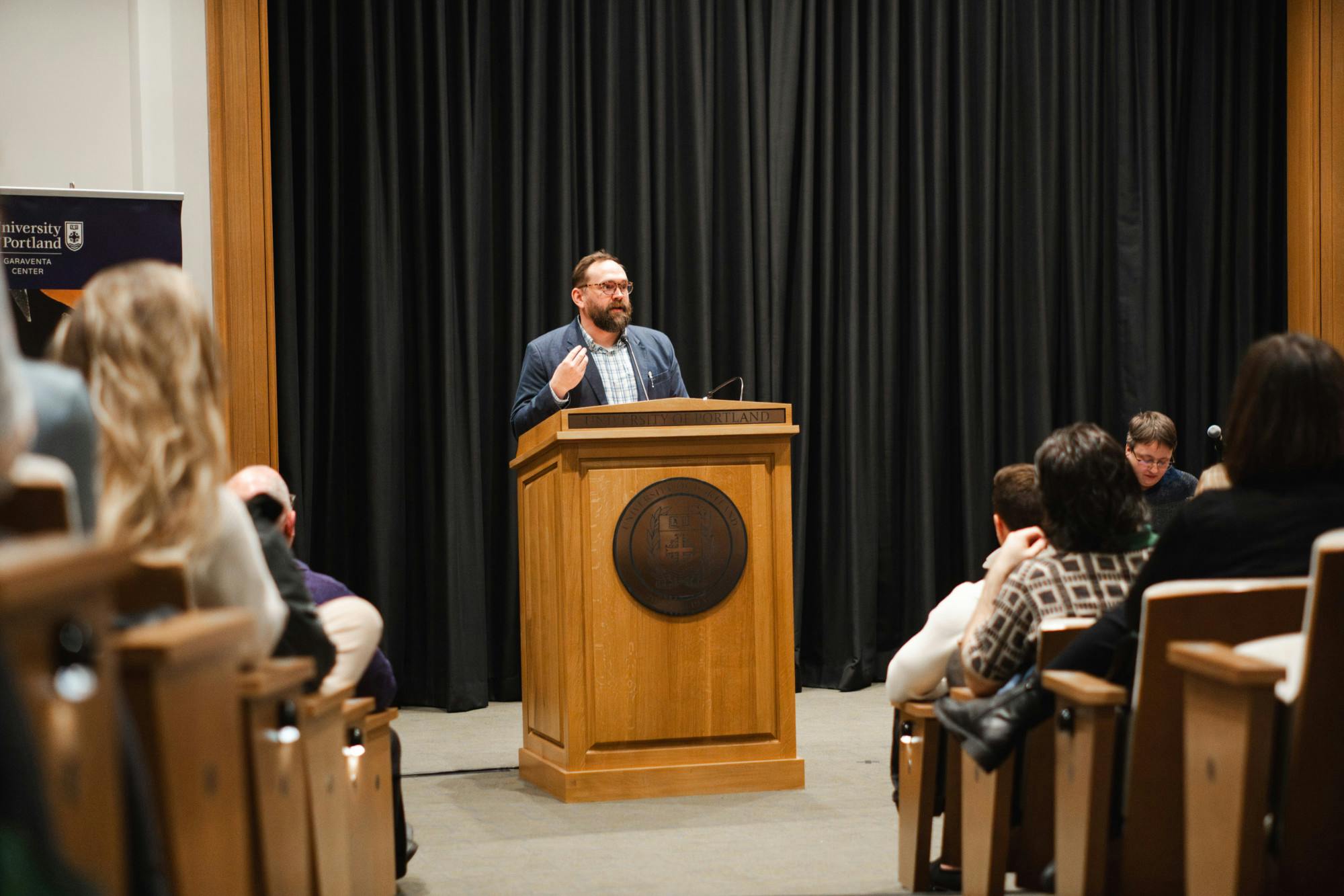David Turnbloom, a University of Portland professor and co-author, speaks during the book launch in Brian Doyle Auditorium on Feb 2.