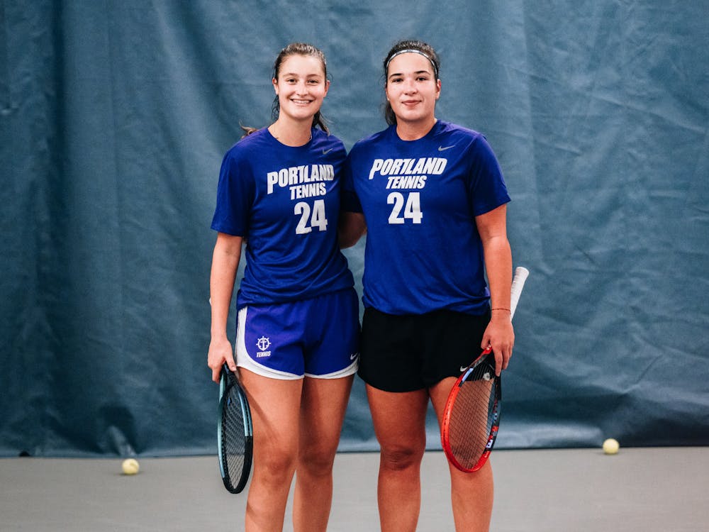 Women's tennis doubles team Sally Pethybridge (left) and Iva Zelic (right) pose for a picture during a practice.
