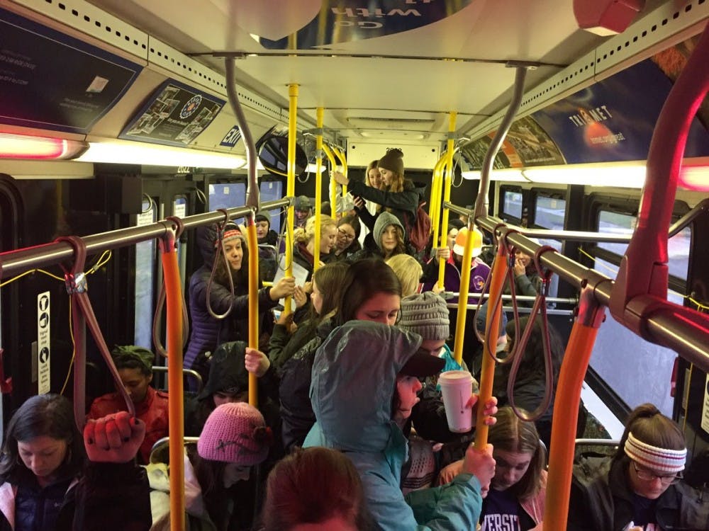 University of Portland students aboard the TriMet bus bound for the Women's March in downtown Portland.
