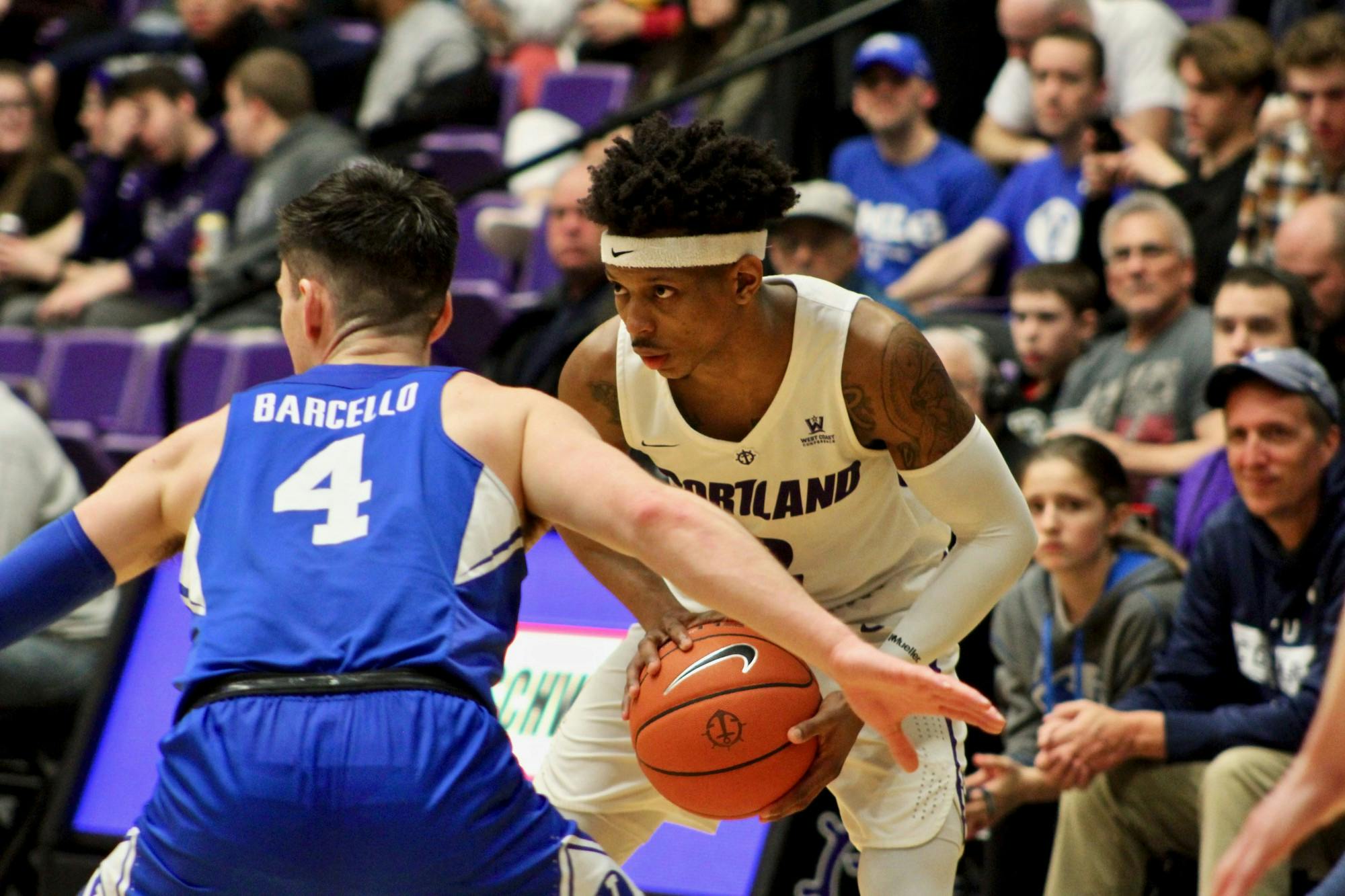 Junior JoJo Walker looks for a teammate to pass to.