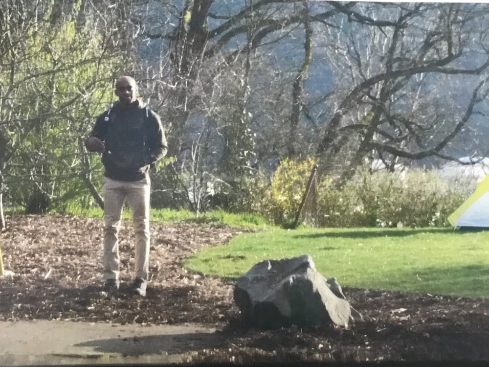Robert Johnson Patterson, 39, stands by a tent he pitched near the SLUG garden. This photo was attached in a campus-wide email sent out Tuesday by Public Safety Director Gerald Gregg. It is unclear how and when the photo was taken. 