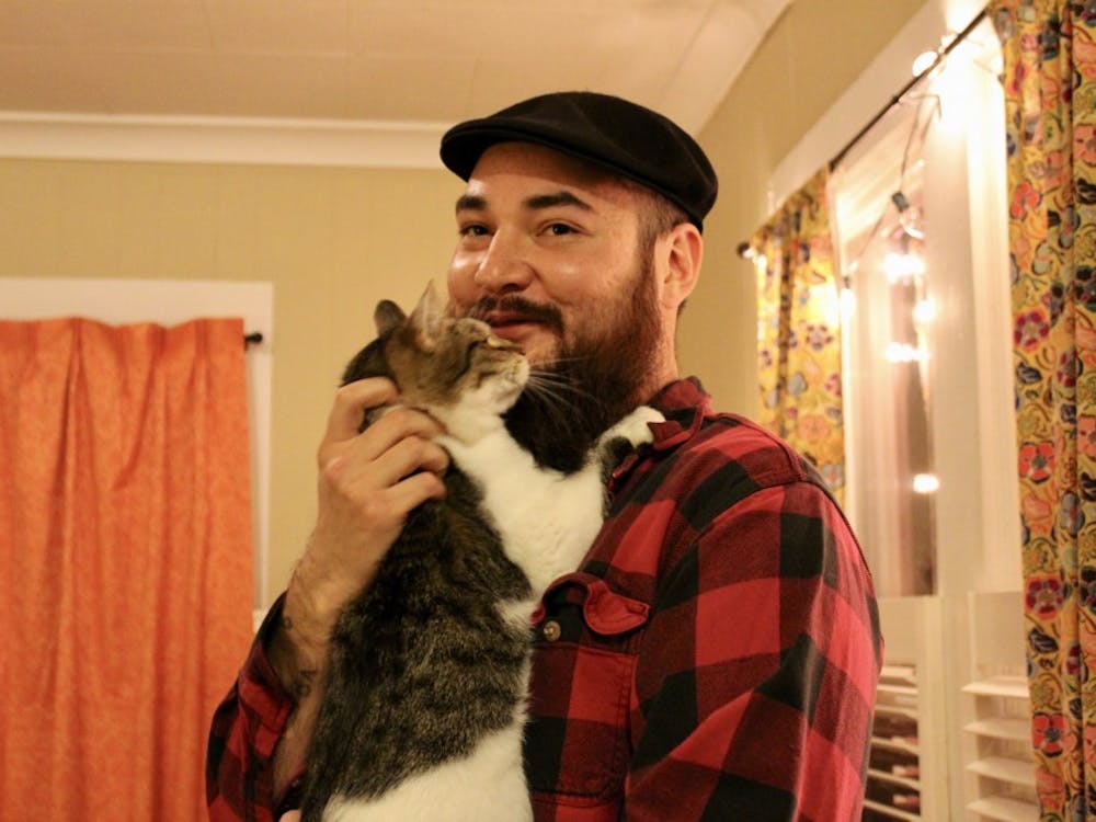 Joseph Mah says that his wife, Mallory Kanaeholo, has worked as a Veterinary Technician for years and had adopted three cats before he met her. Mah has a particularly close bond with Kwitten, pictured here, who likes to rub his face on Mah's beard.