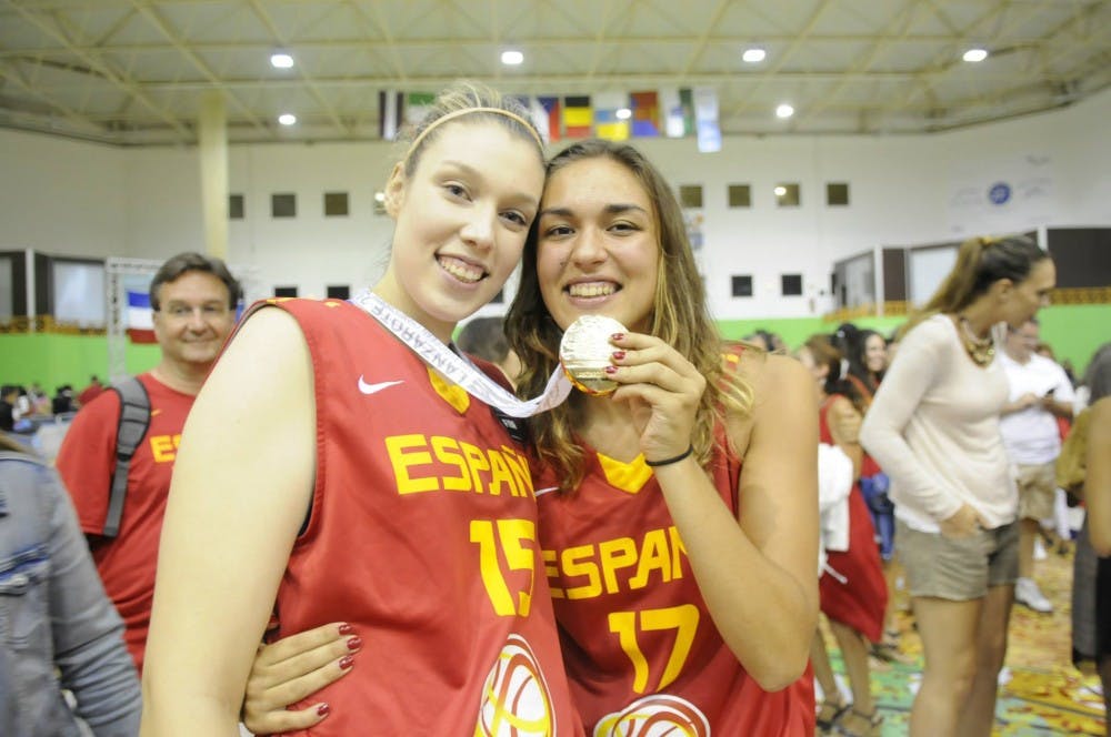  Sophomore Sara Zaragoza poses with Spanish Youth National Team member Ariadna Pujol after winning the Gold Medal in the 2012 European Championships. Zaragoza, who now plays center for the University of Portland’s basktball team, has been on the National Team every year since 2011. | Photo courtesy of Sara Zaragoza