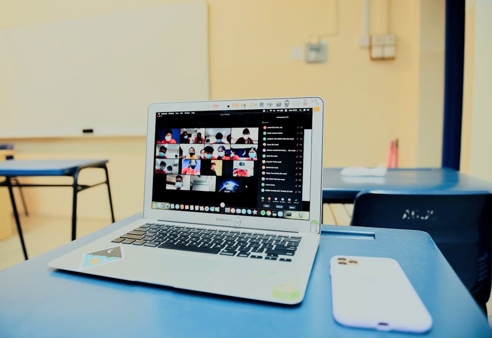 Students congregate via Zoom for online school. Photo by Lucas Law on Unsplash.