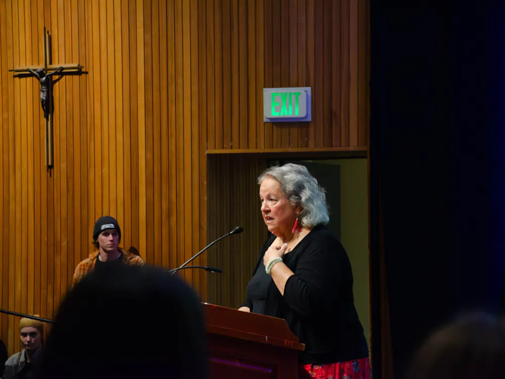 Robin Wall Kimmerer discussing her personal experiences during lecture.