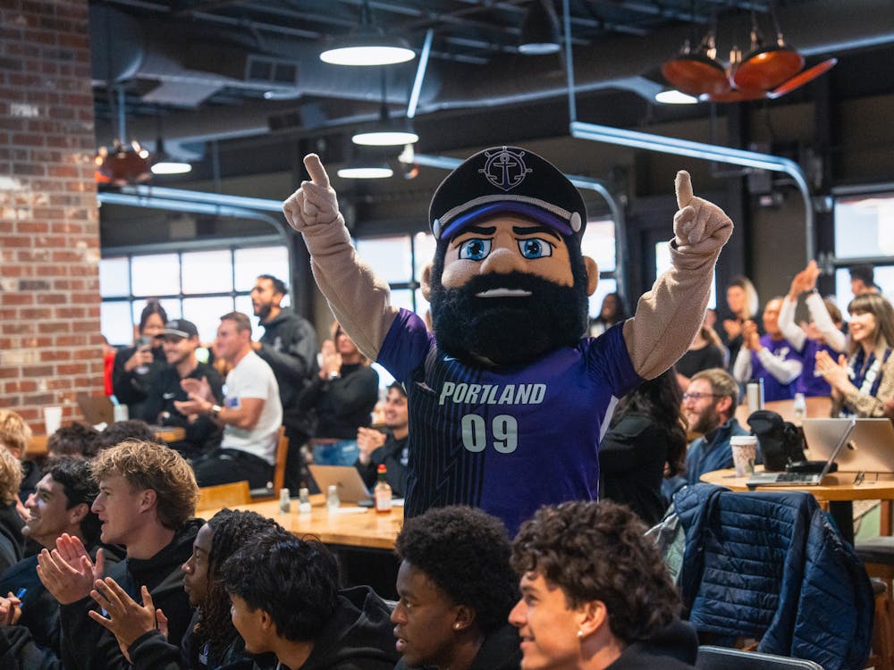 Wally the Pilot cheers during the NCAA men's soccer bracket selection.