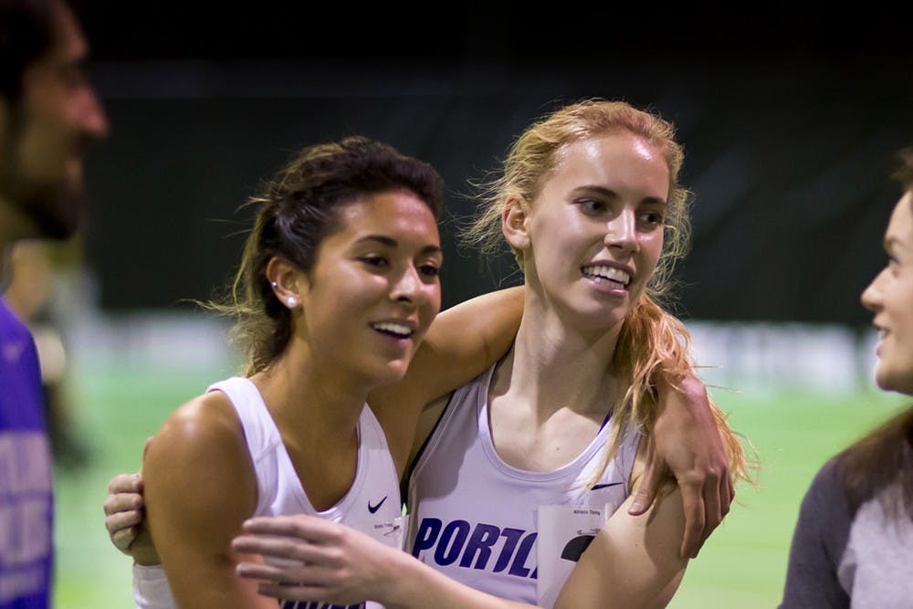  Christina Francisco hugs a teammate after a collegiate race. | Photo courtesy of Christina Francisco.