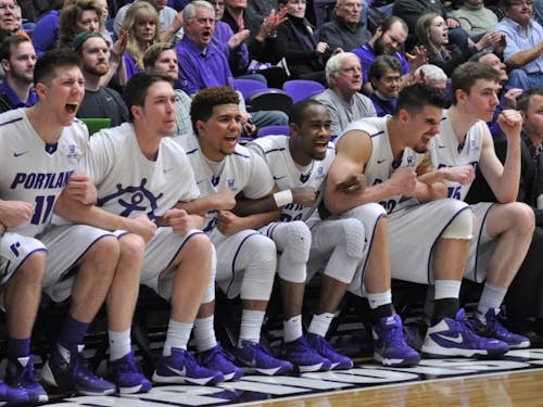  The Portland bench celebrates after the Pilots score. The Pilots defeated BYU 84-83 on Saturday afternoon.