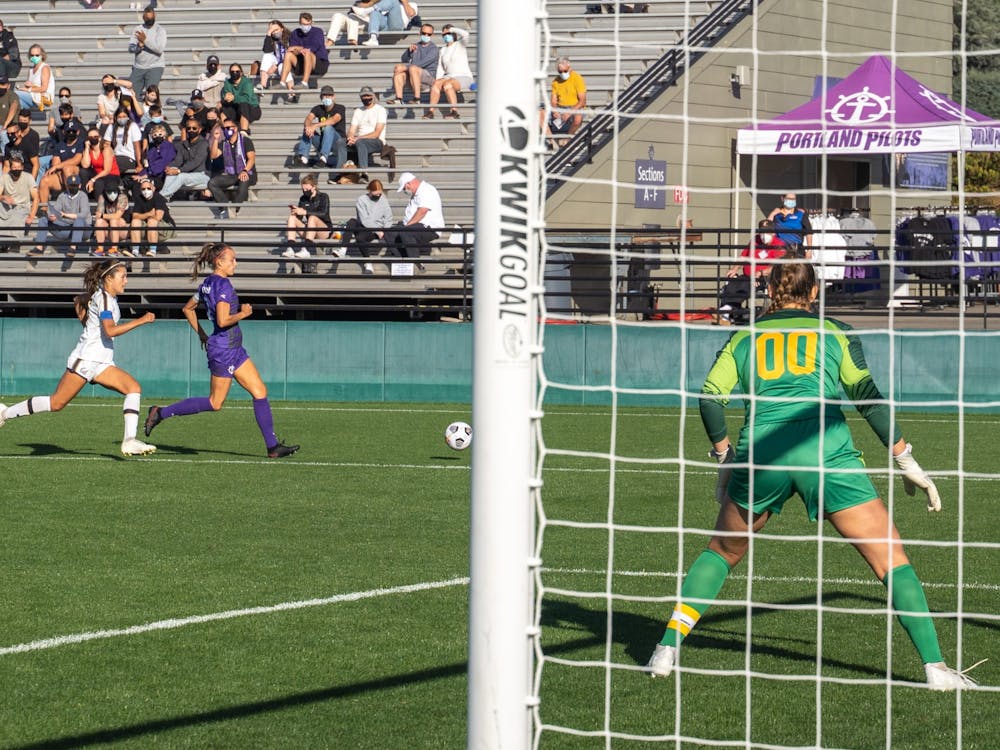 Forward Taryn Ries dribbles towards the California goal.