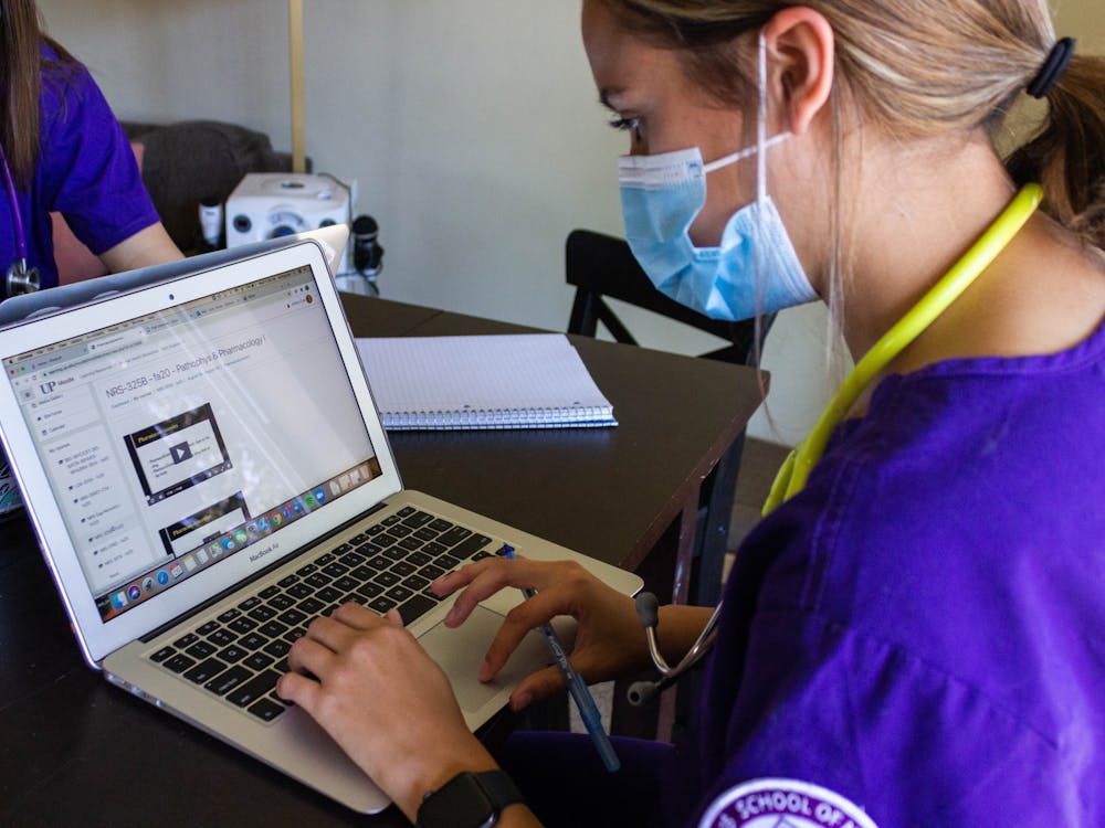 Junior nursing major Ashley Cole scrolls through her online nursing courses. Due to the COVID-19 pandemic, upper-division nursing clinicals, typically held in person, were moved largely online.