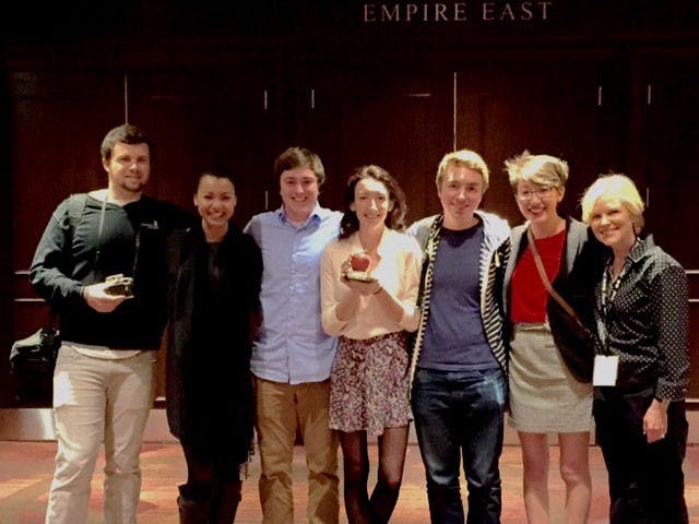  Members of the Beacon staff hold their Apple Award at the College Media Association Convention in New York. The Beacon was awarded the top honor among small college news organizations at the convention. Photo courtesy of Nancy Copic