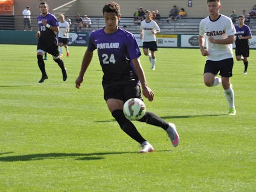  Photo by Kristen Garcia | Freshman Joey Jones dribbles the ball down Merlo Field. Jones scored the Pilots' only goal in the game against Gonzaga. This was his first career goal as a Pilot.