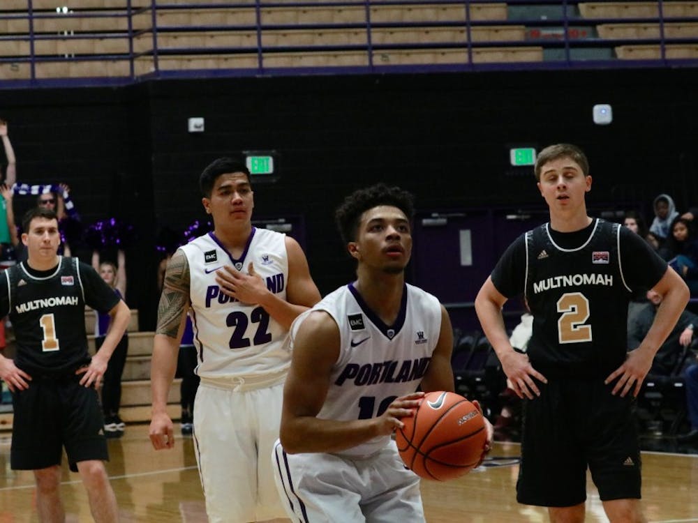 Marcus Shaver Jr. dribbles down court.