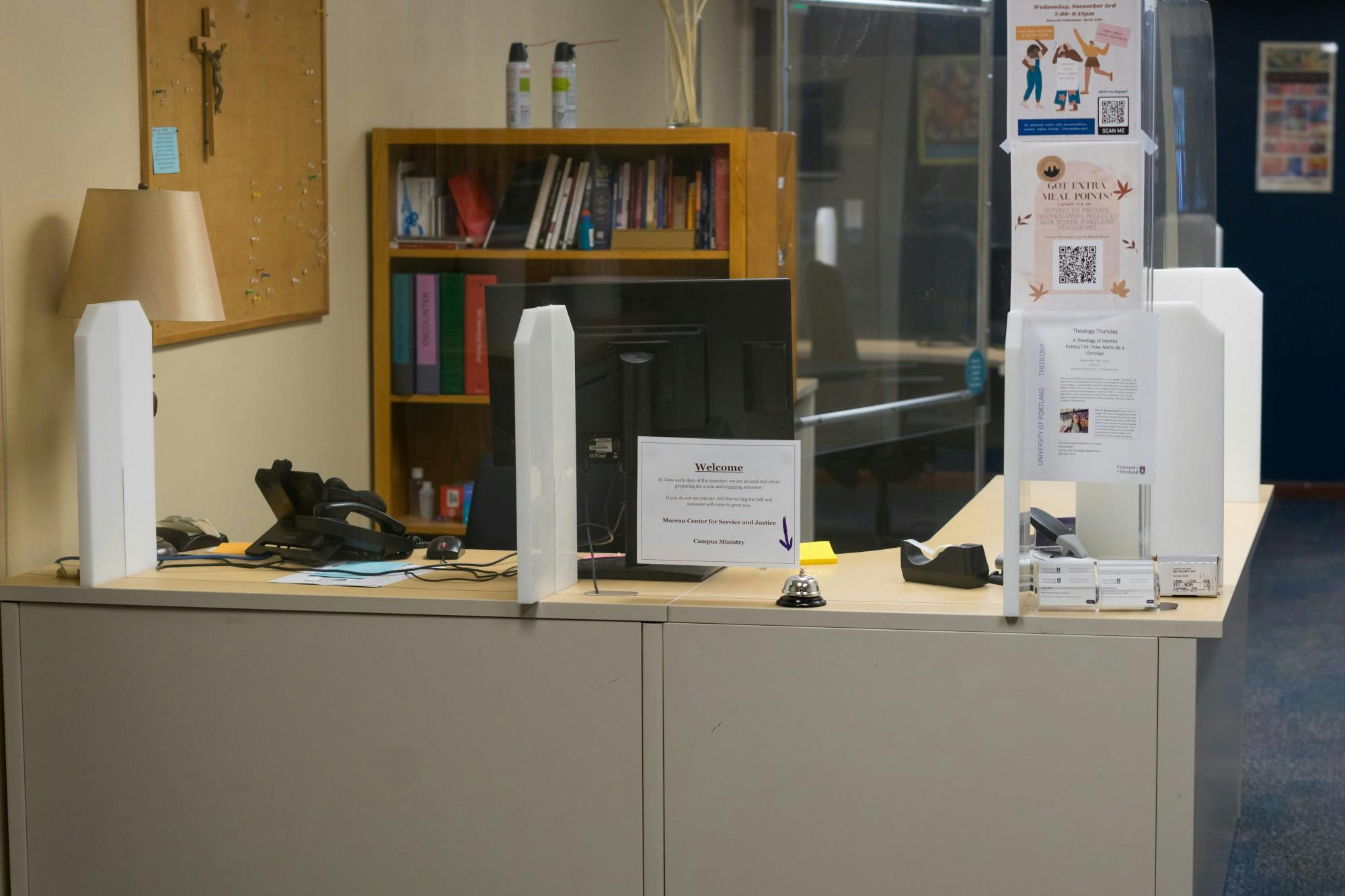 The front desk in the Moreau Center sits vacant, now occupied only by a call bell.