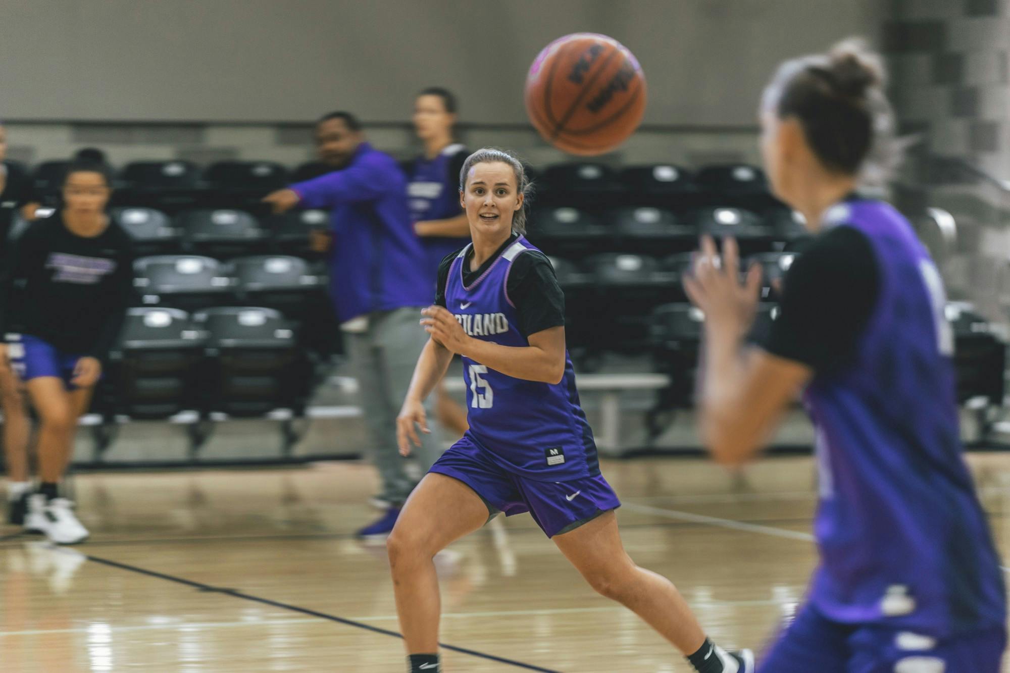 Junior Maddie Muhlheim passes the ball to a teammate on the fly during practice.