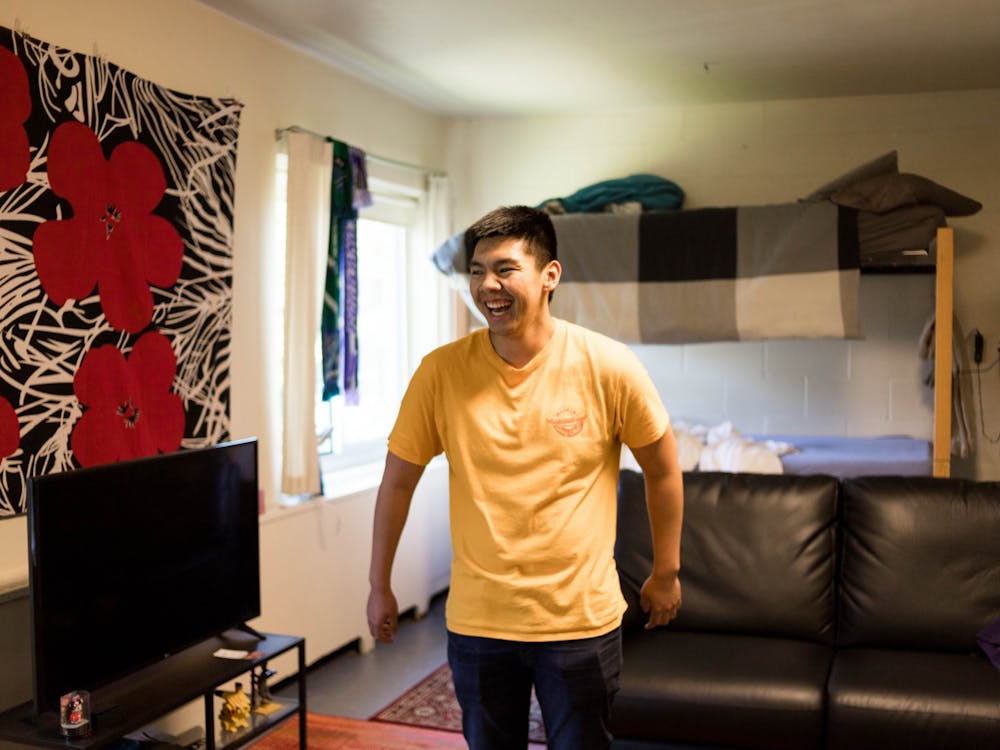 Isley Cachero stands in his dorm in Villa Maria. He has lived in Villa for four years now. 