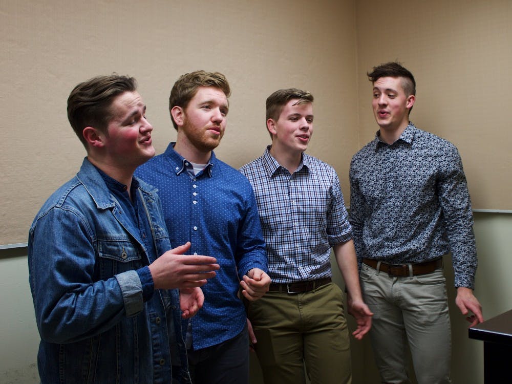 (Left to right) Jesse Persing, Kevin White, Kevin Hendersen, and Brad Henderse​​n practice in the basement of Mago Hunt. The Bluff Boys, UP's only barbershop quartet, is an elite group of singing hobbyists that love to share their passion for music with the community.