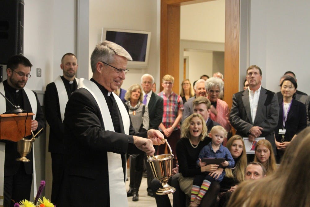 Lund family is present as Fr. Mark Poorman dedicates hall.