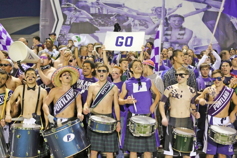  The student section of Saturday's game was filled with the drum squad, boys from the Schoenfeldt and Christie as well as many other UP students.Photo by Becca Tabor