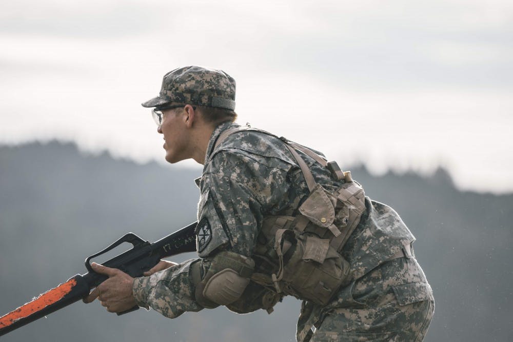Cadet William Weber advances on the enemy through the dense brush of Franz Campus during Reaction Training.