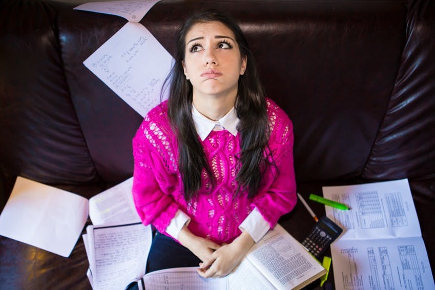 Tired student having a lot to read.Student is studying. Study up