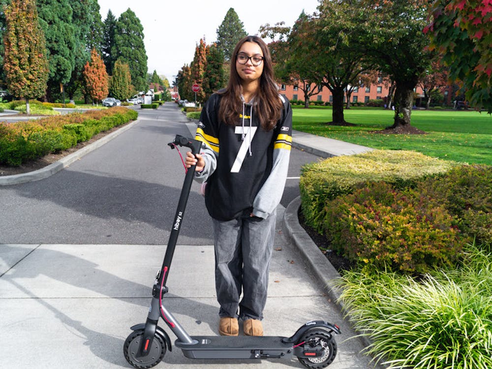 Indoor volleyball player Georgia Haynes poses for a photo with her scooter