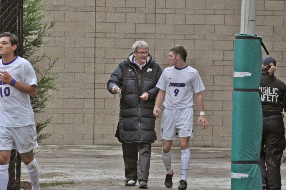  Men’s soccer head coach Bill Irwin talks to freshman forward Aaron Caprio before their game Friday vs Denver.Photo by Kristen Garcia