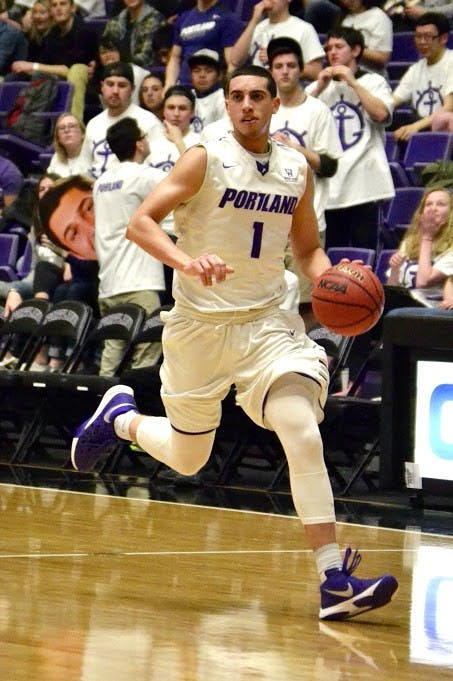  Bryce Pressley dribbles the ball down the court. Pressley had 15 points in his final home game as a Pilot. | Photo by Thomas Demspey