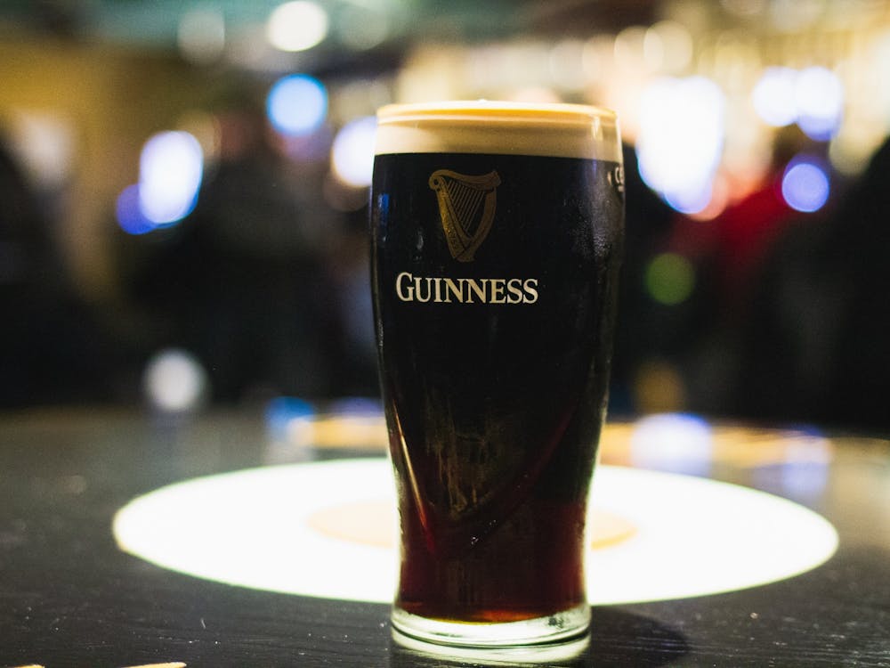 A freshly poured pint of Guinness rests on a table in the famous Guinness Storehouse. 