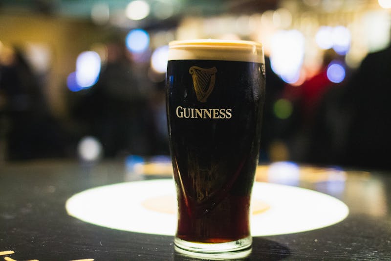 A freshly poured pint of Guinness rests on a table in the famous Guinness Storehouse. 