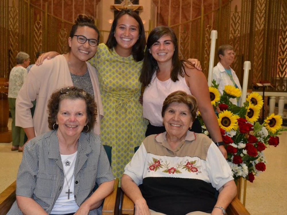 Junior Amanda Hernandez Michalski poses with some of the people she lived in community with during her internship. She lived with the Sisters of St. Joseph in the Medaille House of Discernment. Photo courtesy of Michalski.&nbsp;