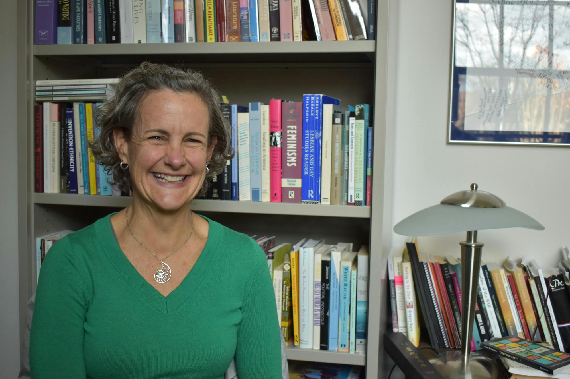 Professor Molly Hiro sits and poses for a photo in her office. 