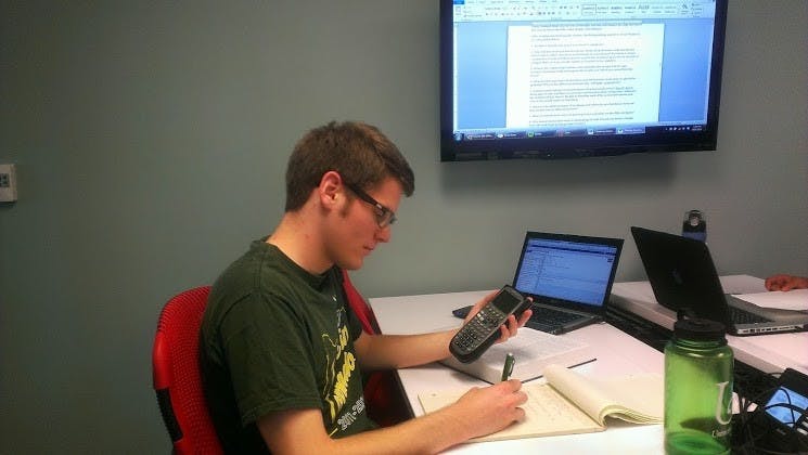  Distinguished Mechanical Engineering major, Mike Hector studies with his stunning TI-89 calculator.Photo by Lydia Laythe