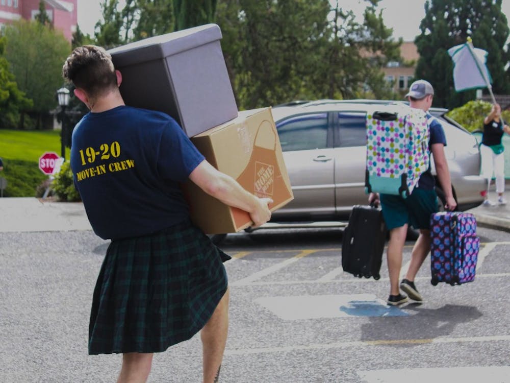 Members of Villa Maria Hall&#x27;s 2019 Move-In Crew carry luggage and boxes to the dorms in August 2019. In an email brief sent to incoming freshmen and their parents on Friday, the University announced the possibility that the 2020 fall semester will have a late start due to COVID-19. 
