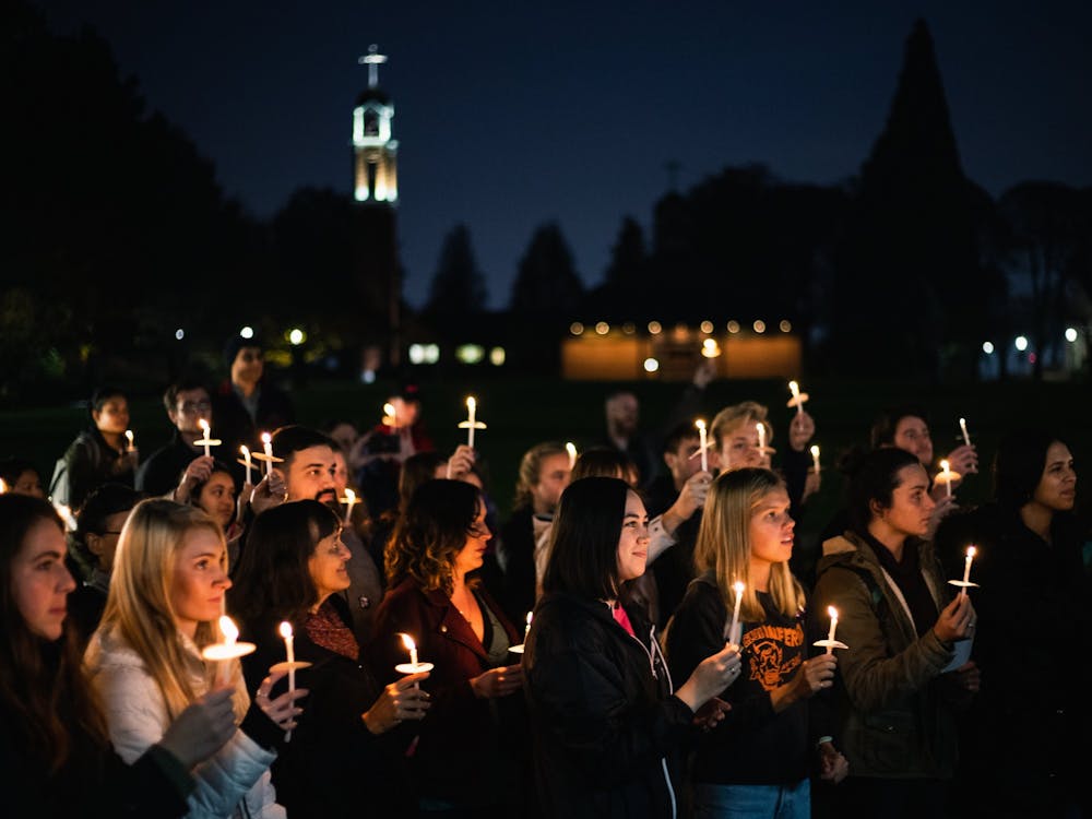 A crowd of students gathered in front of Franz to participate in a vigil to show support for DACA.