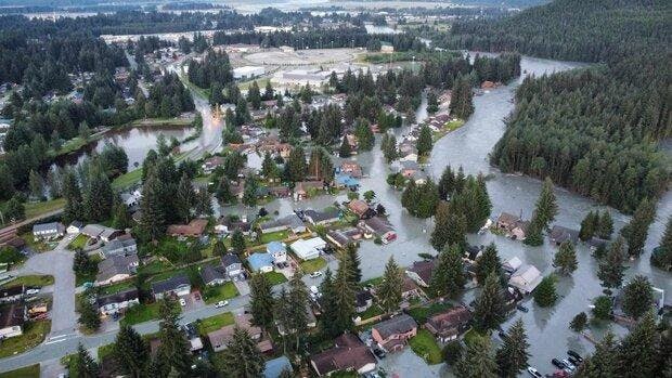 Flooding caused by a glacial outburst fills the streets of Juneau, Alaska in August 2024. Social media reporter Naara Conlon's house was damaged in the flood. Media credit: Alaska National Guard via Climate.gov.
