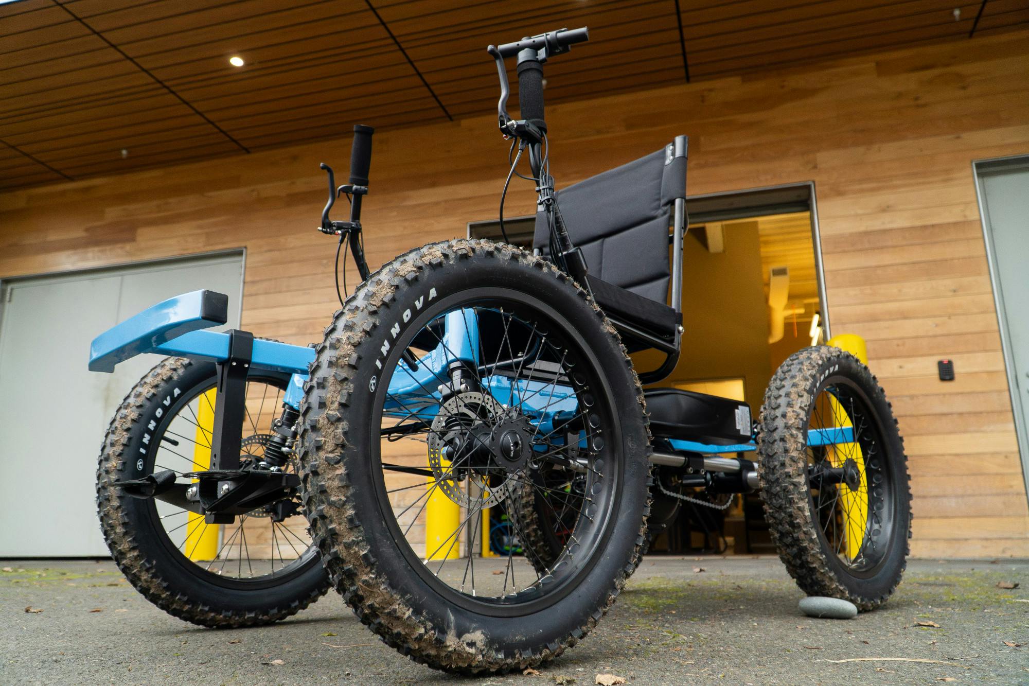 An off-road wheelchair offered by the University of Portland’s Outdoor Pursuits program sits outside the Outdoor Pursuits garage on campus. The chair is designed to help students navigate trails and rugged outdoor environments.