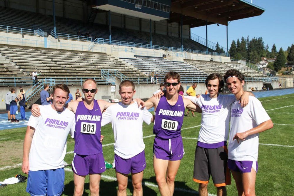  A few members of the men’s cross country team celebrate a strong showing against Illinois last weekend where they had runners take first second and third place to take first place overall.Photo courtesy of UP Athletics
