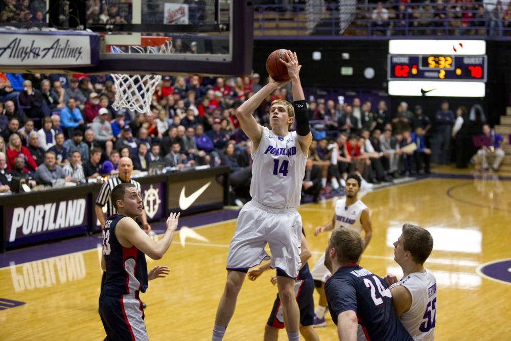  Riley Barker takes a shot over Bulldog defenders. The Pilots had a 46.7 field goal percentage in the game.