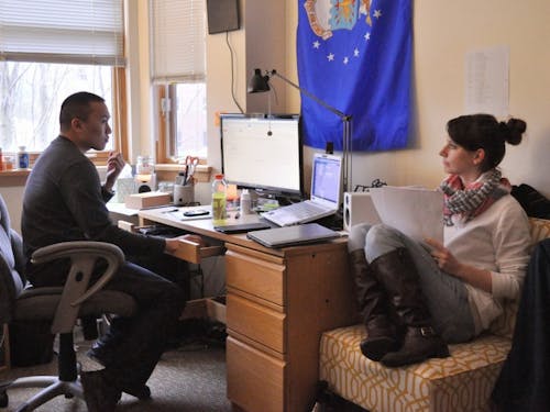  Seniors Kevin Ratuiste and Mairi Rodriguez do homework together in Kevin's Tyson apartment. Ratuiste and Rodriguez will be married in December, 2014. Photo by Kristen Garcia.