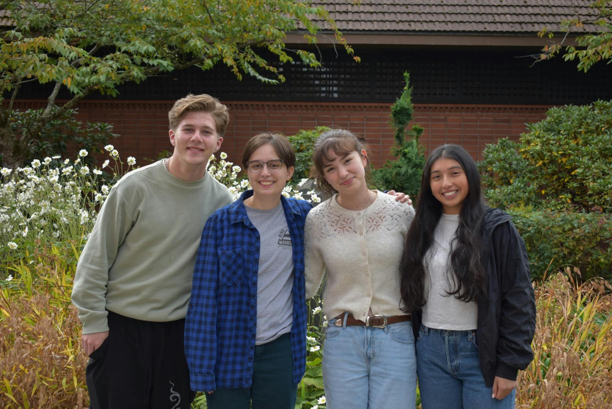 Ethan Zettler-Bray, Michaela Gold, Gabriela Hernandez and Natalia Vazquez-Trejo stand together for a photo outside Saint Mary's Student Center.
