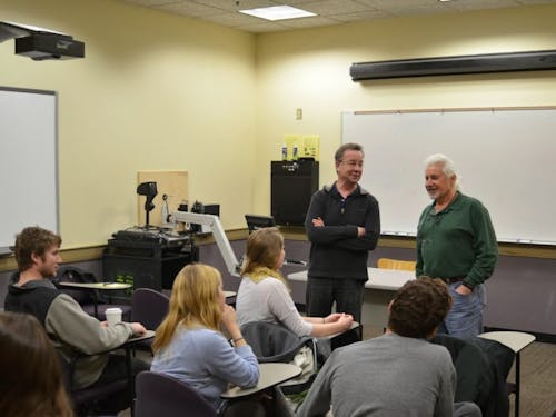  Steve Kolmes and Russell Butkus joint-teach ENV 400, integrating seminar in environmental science. Students enjoy their bantering humor in the classroom. Photo by Parker Shoaff