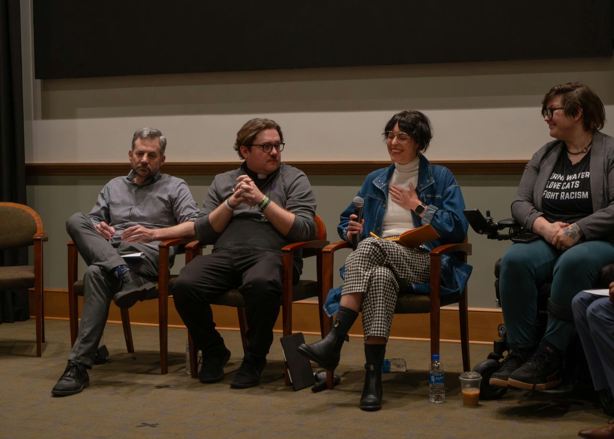 Dr. Lauren Alfrey, a sociology professor, holds her arm on her chest as she smiles. Dr. Alfrey spoke on a panel with other members of the community to finish out the 3-day MLK Day ON sequence at UP. Photo by Q Acosta.